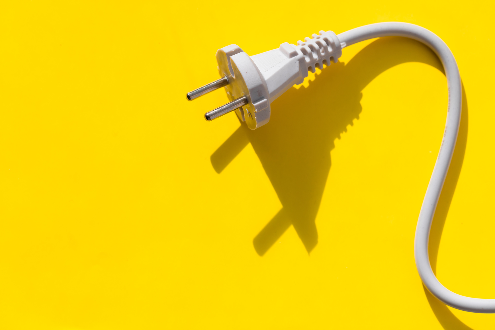 White Plug on Yellow Background